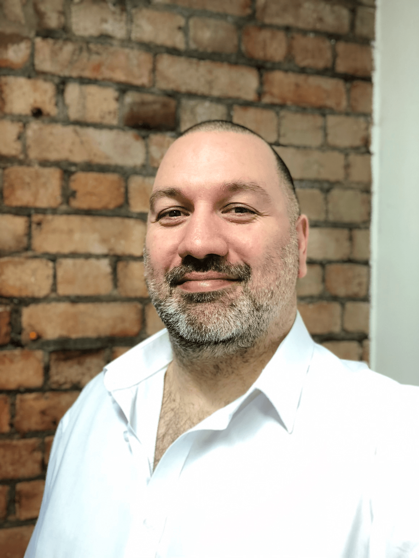 A profile photograph of Jaymie Thomas